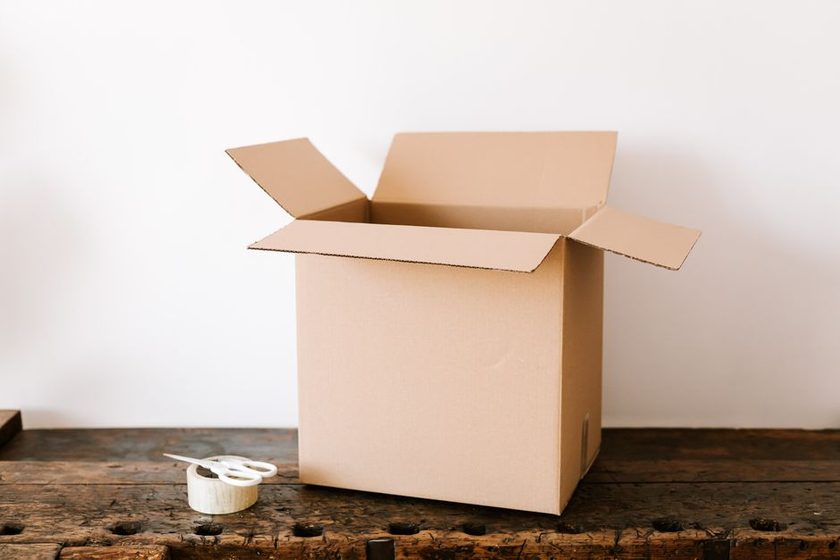 Moving boxes stacked by size and weight in a hallway, arranged in an orderly load sequence